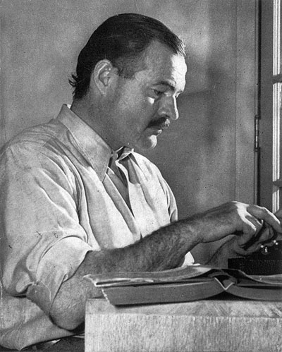 Ernest Hemingway, writing, Hemingway at typewriter, nobel prize for literature, hills like white elephants, the old man and the sea - HeadStuff.org