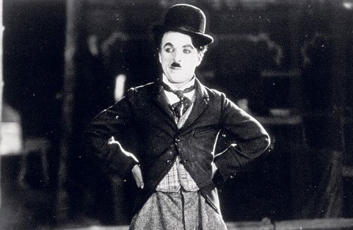 Charlie Chaplin, The Tramp, 100 years old, chaplin's tramp, kid auto races, the kid, modern times, City Lights, silent films, talkies, charlie chaplins first film - HeadStuff.org
