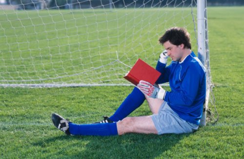 Football player reading, in marriage shock, scandal, clever player, no scandals, nice guy, likeable, satire - HeadStuff.org