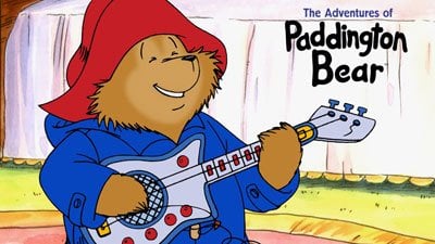 Paddington Bear, modern version, colour drawing, red hat, blue coat, paddington playing guitar, recent version, modern illustration, Michael Bond, lasting characters, books for all ages, british children's books, love paddington bear, british institution, books you never forget, books that stay with you, childhood books that stay with you - HeadStuff.org