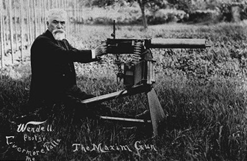 Maxim Gun, The first machine gun, Hiram Maxim in a publicity photo with one of the later models of the Maxim gun, weapon of death, killed millions, bad people in history - HeadStuff.org