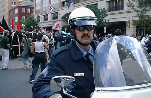 motorcycle cop, police cop with moustache on motorbike with shades, Movember, moustaches, why do cops have moustaches? why police have moustache?, ronnier, facial hair - HeadStuff.org