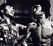 Bruce lee punching someone and flexing, 0% body fat, muscles, muscle mass, martial arts - HeadStuff.org