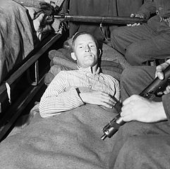 Wiliam Joyce, Nazi propagandist, in a hospital bed after his capture by the Allies - headstuff.org