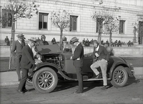 Old Timey Men Standing Around A Car - HeadStuff.org