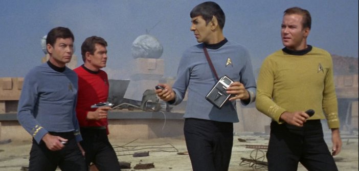 Bones, Spock and Kirk in Season 1 of Star Trek TOS. Also featuring a red shirt who probably survived and lived a long and happy life. - HeadStuff.org