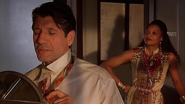 Fred Ward and Arnetia Walker in Cast A Deadly Spell