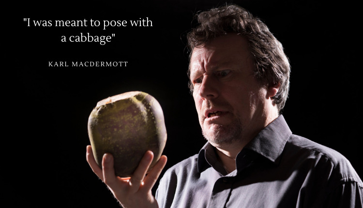 Karl MacDermott holding a turnip instead of a cabbage in a promo for his book 58% Cabbage