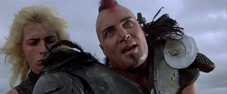 Jerry O'Sullivan and Vernon Wells in Mad Max 2 - headstuff.org